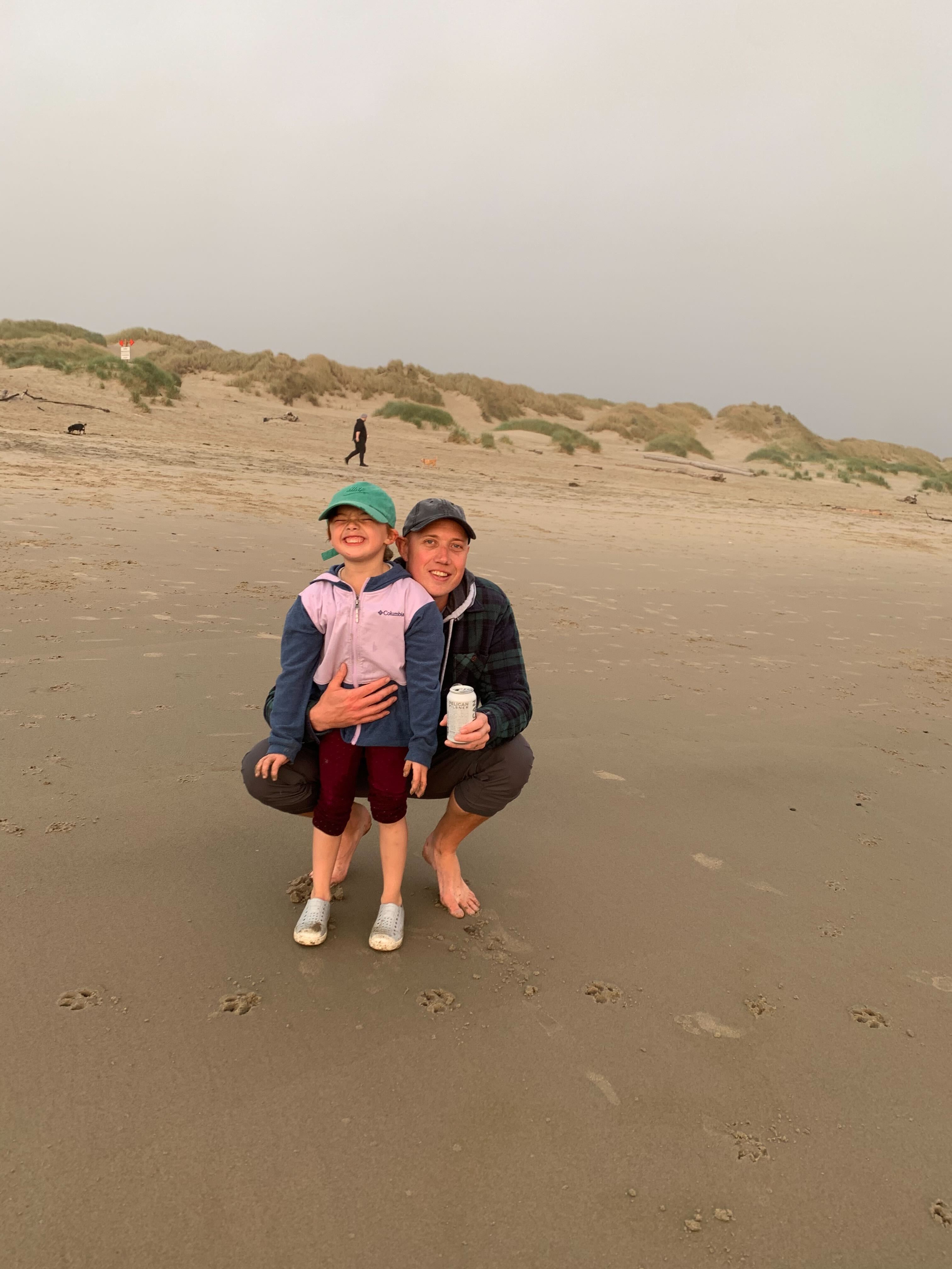 Brett and his daughter at the Oregon coast